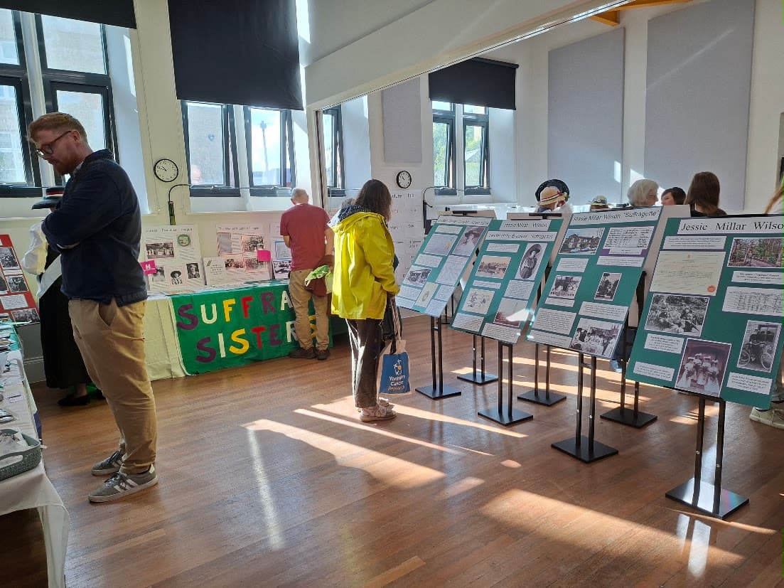 Visitors exploring the Suffrage Sisters Shipley and Saltaire launch exhibition